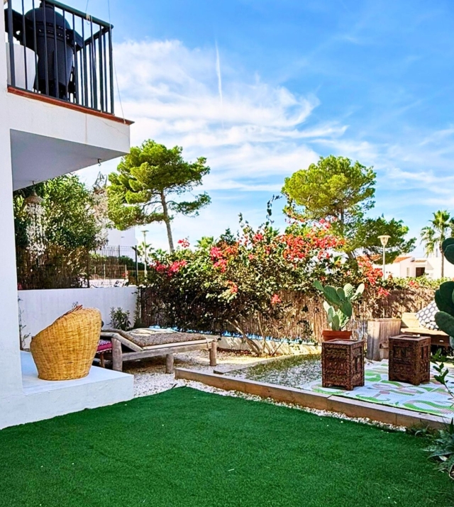 Resa Estates Ibiza Cala Tarida first line 3 bedrooms garden grass.jpg